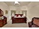 Spacious main bedroom featuring a large bed, a ceiling fan, and neutral decor at 777 Glen Valley Way, Dacula, GA 30019