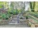 Stone steps with landscaping leading to the house and backyard at 8530 Hightower Trl, Snellville, GA 30039