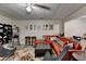 Finished basement featuring a red leather sectional sofa, eclectic decor, and a cozy atmosphere for relaxation and entertainment at 8530 Hightower Trl, Snellville, GA 30039