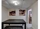 Finished basement featuring neutral walls, carpet, artwork, and a large table for dining or activities at 8530 Hightower Trl, Snellville, GA 30039