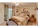 Cozy bedroom with a comfortable queen-sized bed, neutral walls, and access to an outdoor area at 8530 Hightower Trl, Snellville, GA 30039