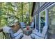 Outdoor deck with outdoor seating area, perfect for relaxing and enjoying the surrounding nature at 8530 Hightower Trl, Snellville, GA 30039