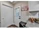 Interior entryway with a door leading outside and a lake-themed sign at 8530 Hightower Trl, Snellville, GA 30039