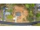 Aerial view of a home surrounded by lush greenery, showcasing its driveway and nearby street access at 5747 S Gordon Rd, Austell, GA 30168