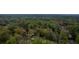 An aerial view showcasing the home surrounded by dense foliage, offering a glimpse of the neighborhood at 5747 S Gordon Rd, Austell, GA 30168