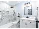 Stylish bathroom features a walk-in shower with marble-patterned tile and modern vanity at 5747 S Gordon Rd, Austell, GA 30168