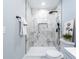 Clean bathroom showcasing walk-in shower with marble-patterned tile and modern fixtures at 5747 S Gordon Rd, Austell, GA 30168