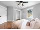 Comfortable bedroom with hardwood floors, open closet, and plenty of natural light at 5747 S Gordon Rd, Austell, GA 30168
