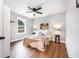 Bright bedroom with light hardwood floors, neutral walls, and ample natural light at 5747 S Gordon Rd, Austell, GA 30168