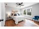Spacious bedroom with hardwood floors, natural light, and a ceiling fan at 5747 S Gordon Rd, Austell, GA 30168