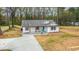 Spacious, white one-story home with a well-manicured yard and a newly installed privacy fence at 5747 S Gordon Rd, Austell, GA 30168