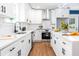 Modern kitchen featuring white cabinets, stainless steel appliances, and stylish hardware at 5747 S Gordon Rd, Austell, GA 30168