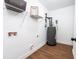 Bright laundry room features white walls, wire shelving, and a modern water heater at 5747 S Gordon Rd, Austell, GA 30168