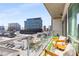 Outdoor balcony with seating and greenery offers a serene city view, perfect for relaxation at 1100 Howell Mill Nw Rd # 711, Atlanta, GA 30318