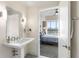 Bright bathroom leading into a bedroom that has a beautiful view from the bedroom window at 1100 Howell Mill Nw Rd # 711, Atlanta, GA 30318