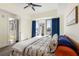 Well lit bedroom with outdoor access, large windows and city view, features a bed with unique design at 1100 Howell Mill Nw Rd # 711, Atlanta, GA 30318