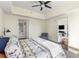 Bright bedroom with view to living area features a bed with unique design, carpeted floor, and ceiling fan at 1100 Howell Mill Nw Rd # 711, Atlanta, GA 30318