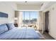 Light filled bedroom with balcony and outdoor access offering stunning city views at 1100 Howell Mill Nw Rd # 711, Atlanta, GA 30318