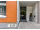 Building entrance with modern architecture, visible address, and accessible entryway with glass doors at 1100 Howell Mill Nw Rd # 711, Atlanta, GA 30318