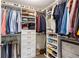 Walk-in closet featuring custom shelving, ample storage, and organized space for clothing and accessories at 1100 Howell Mill Nw Rd # 711, Atlanta, GA 30318