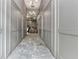 Hallway with neutral paint, marble floors, modern lighting, and stylish doors, creating a welcoming ambiance at 1100 Howell Mill Nw Rd # 711, Atlanta, GA 30318