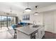 Kitchen island sink features stainless appliances and bright lighting at 1100 Howell Mill Nw Rd # 711, Atlanta, GA 30318