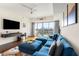 Modern living room features city views, contemporary furnishings, and hardwood floors at 1100 Howell Mill Nw Rd # 711, Atlanta, GA 30318