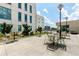 Outdoor seating area with tables, chairs, and greenery, ideal for outdoor enjoyment at 1100 Howell Mill Nw Rd # 711, Atlanta, GA 30318
