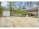 Expansive backyard with detached garage and covered parking area at 1910 Thompson Ave, East Point, GA 30344