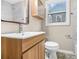 Bathroom showcasing stylish vanity, patterned floors, and window at 1910 Thompson Ave, East Point, GA 30344