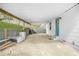 Spacious carport offering covered parking and convenient access to the home's entrance with a blue door at 1910 Thompson Ave, East Point, GA 30344