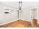 Bright and airy dining room with hardwood floors adjacent to the kitchen at 1910 Thompson Ave, East Point, GA 30344