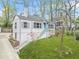Charming home exterior featuring a well-maintained front yard with beautiful landscaping at 1910 Thompson Ave, East Point, GA 30344