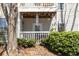 Private balcony offering a peaceful outdoor retreat shaded by mature trees and greenery at 303 Gettysburg Pl, Atlanta, GA 30350