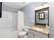 Well-maintained bathroom with a shower, tub, vanity, and updated fixtures at 303 Gettysburg Pl, Atlanta, GA 30350