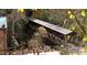 Idyllic covered bridge amidst lush fall foliage and verdant trees at 303 Gettysburg Pl, Atlanta, GA 30350