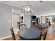 Open concept dining area with view into the updated kitchen and cozy living room at 303 Gettysburg Pl, Atlanta, GA 30350