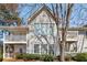 Inviting two-story condo featuring large windows and cozy private balcony spaces at 303 Gettysburg Pl, Atlanta, GA 30350
