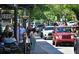 Charming street view showcasing pedestrian activity and vibrant street-side cafe seating at 303 Gettysburg Pl, Atlanta, GA 30350