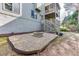 Backyard with patio, fire pit, and lush landscaping at 4880 Stone Moss Path, Hoschton, GA 30548