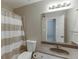 Bathroom with a shower/tub combination, modern vanity, and neutral color scheme at 4880 Stone Moss Path, Hoschton, GA 30548