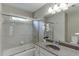 Bathroom featuring a shower with glass doors, granite countertop, and modern fixtures at 4880 Stone Moss Path, Hoschton, GA 30548