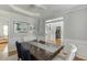 Elegant dining room features hardwood floors, and decorative accents at 4880 Stone Moss Path, Hoschton, GA 30548