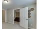 Bright hallway leads into the living room and features neutral walls and carpet at 4880 Stone Moss Path, Hoschton, GA 30548