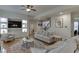 Spacious living room with hardwood floors, built-in shelves, and neutral decor at 4880 Stone Moss Path, Hoschton, GA 30548