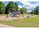 Well-maintained community playground equipped with slides, swings, and ample seating for families at 4880 Stone Moss Path, Hoschton, GA 30548