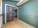 Balcony with wood floors and green siding, offering a private outdoor space at 4640 Vinings Central Se Run # 128, Atlanta, GA 30339