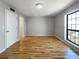 Spacious bedroom with hardwood floors, closet, and large window allowing lots of natural light at 4640 Vinings Central Se Run # 128, Atlanta, GA 30339