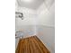 Walk-in closet with custom shelving and hardwood floors at 4640 Vinings Central Se Run # 128, Atlanta, GA 30339