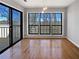 Bright dining area featuring hardwood floors, big windows, and sliding doors to outdoor deck at 4640 Vinings Central Se Run # 128, Atlanta, GA 30339